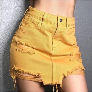 Pac Sun LA distressed denim min skirt. Yellow mustard